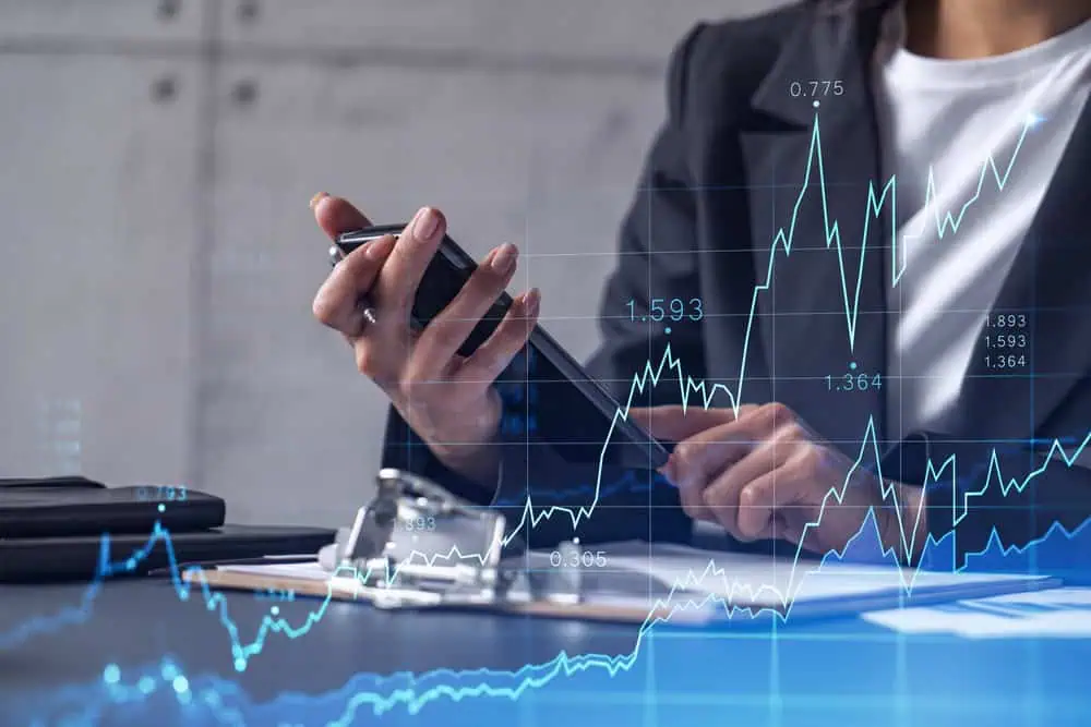 a,woman,financial,trader,in,formal,wear,is,checking,the