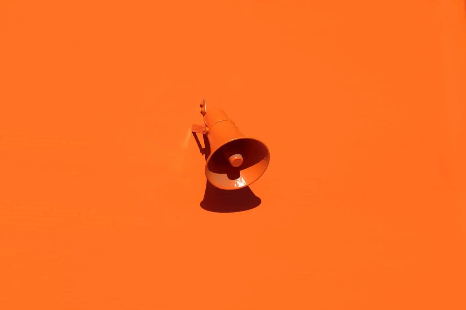orange megaphone on orange wall